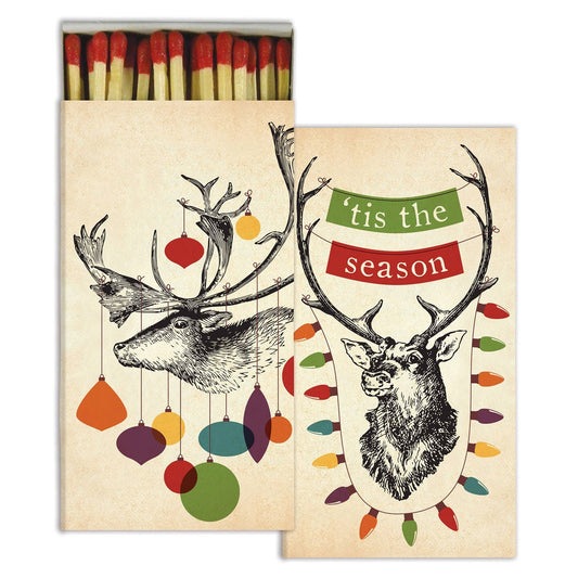 Matches with Christmas-themed design featuring deer and colorful ornaments on a beige background.