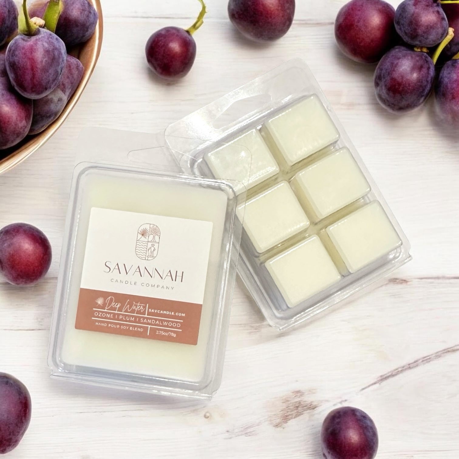 Savannah Candle Company wax melts with plums on a sandalwood surface