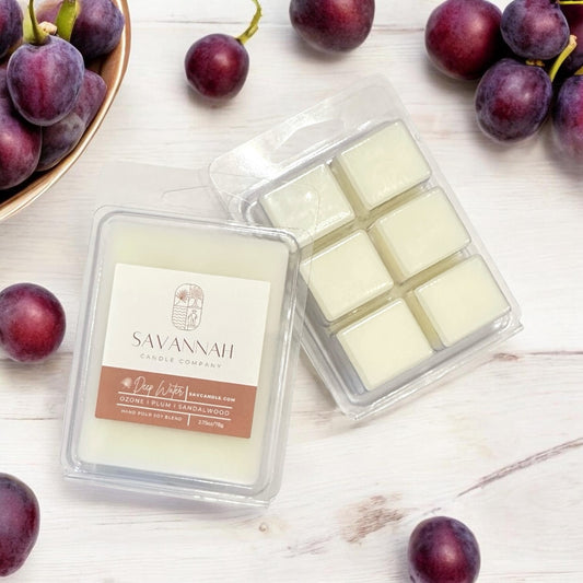 Savannah Candle Company wax melts with plums on a sandalwood surface