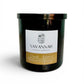 Black candle jar with a label from Savannah Candle Company on a white background.  Fragrance is cardamom, black tea, and grapefruit.  The candle’s name is veranda.
