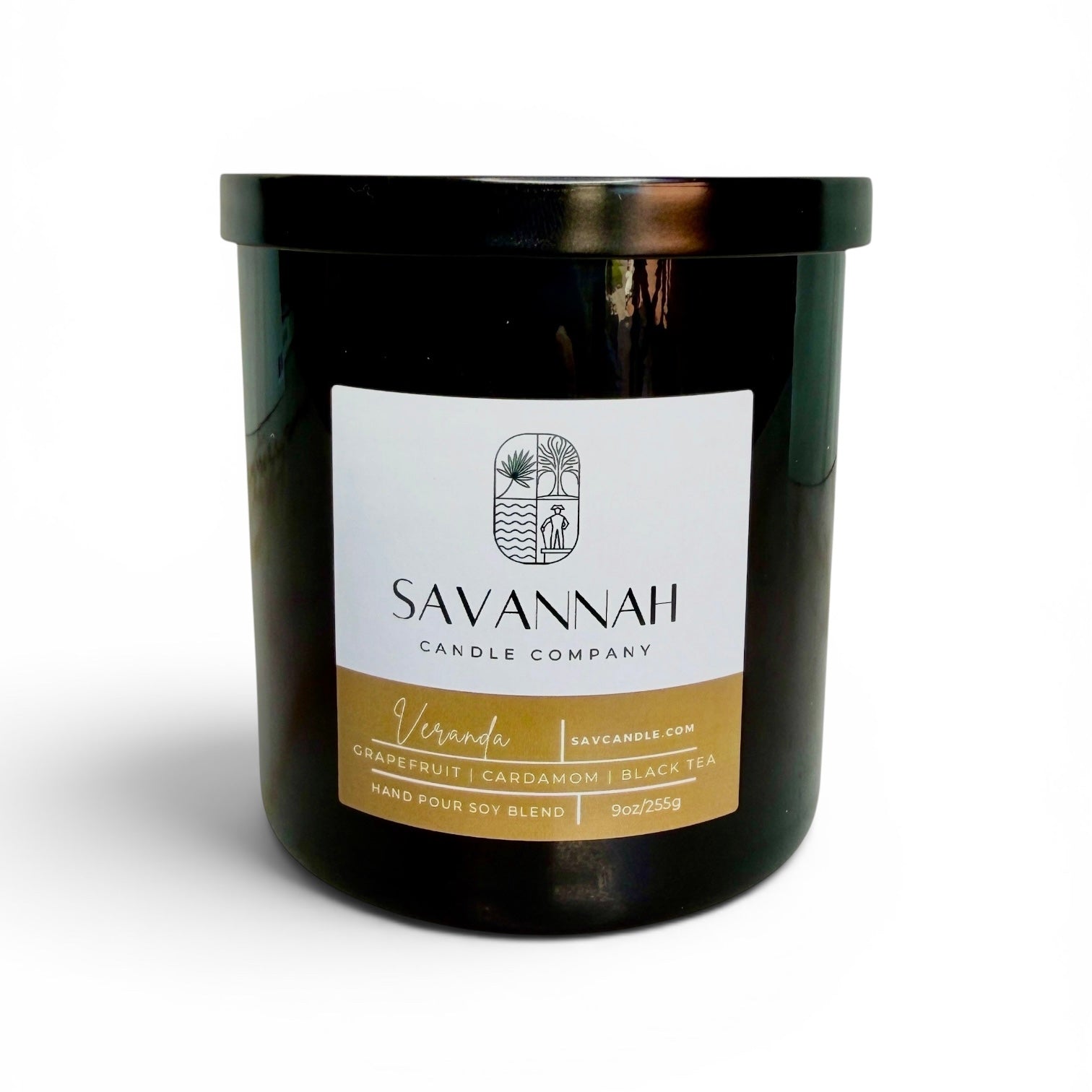 Black candle jar with a label from Savannah Candle Company on a white background.  Fragrance is cardamom, black tea, and grapefruit.  The candle’s name is veranda.